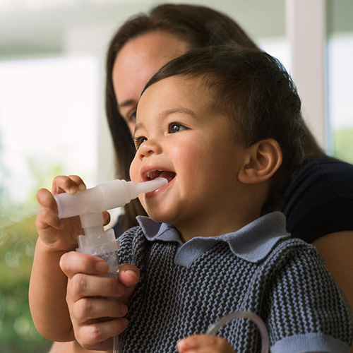 Baby using a nebulizer.